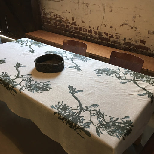 Table linen and cushion covers hand printed with images of Australian native plants and other images