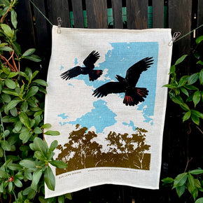 Black Cockatoos in flight tea towel