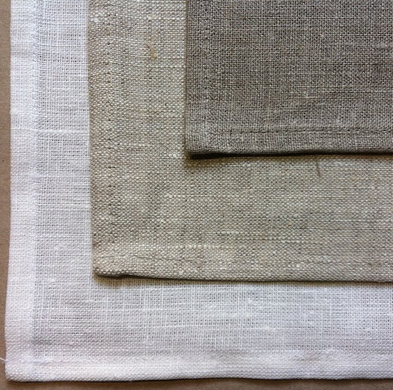 Photograph of linen in three different background colours.