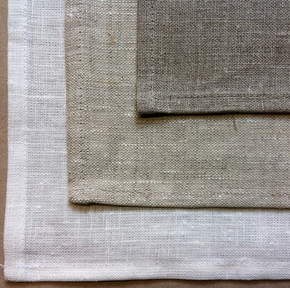 Photograph of linen in three different background colours.