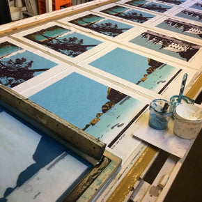 Photograph of linen tea towels being screenprinted.