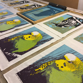 Photograph of native bird tea towels being printed.