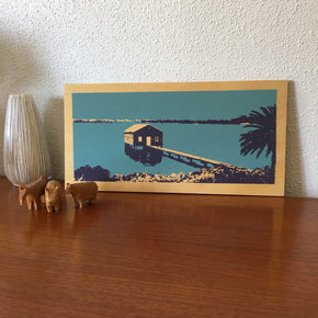 Photo of a blue boathouse on Perth's Swan River, screenprinted on plywood.