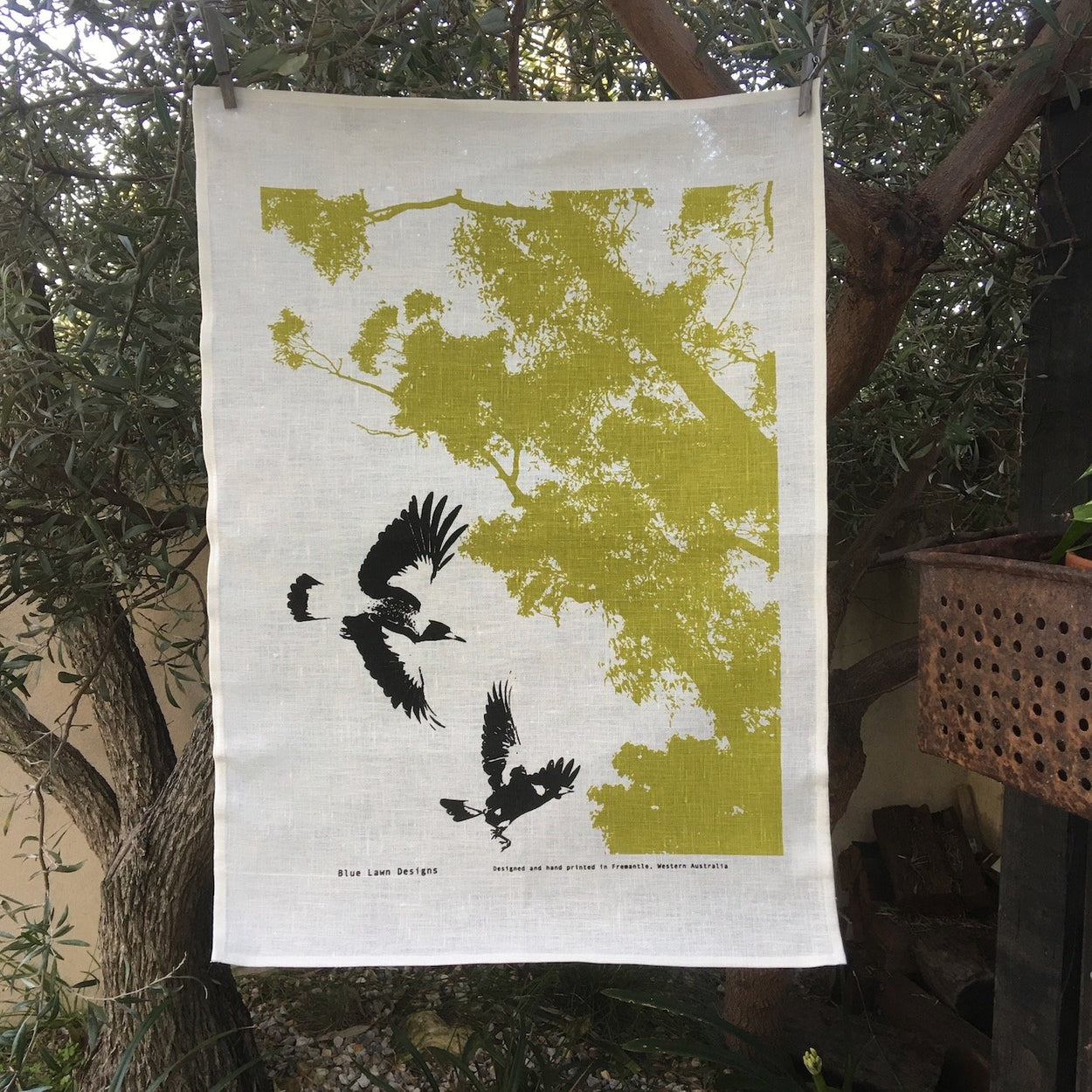 Photo of magpies screen printed on a tea towel.